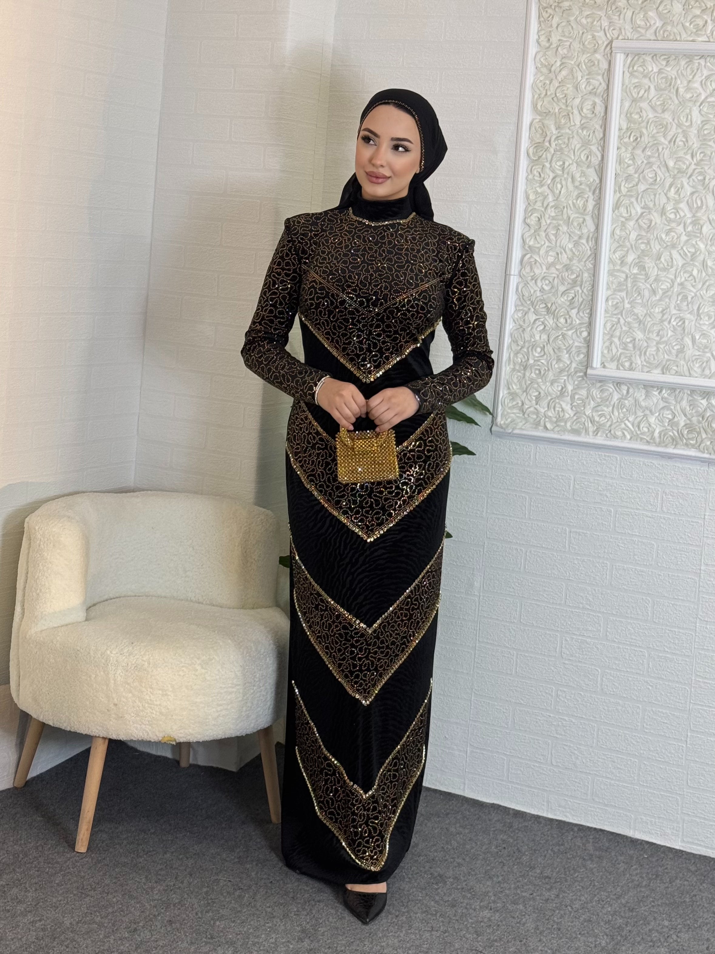 Black velvet evening dress decorated with gold stones