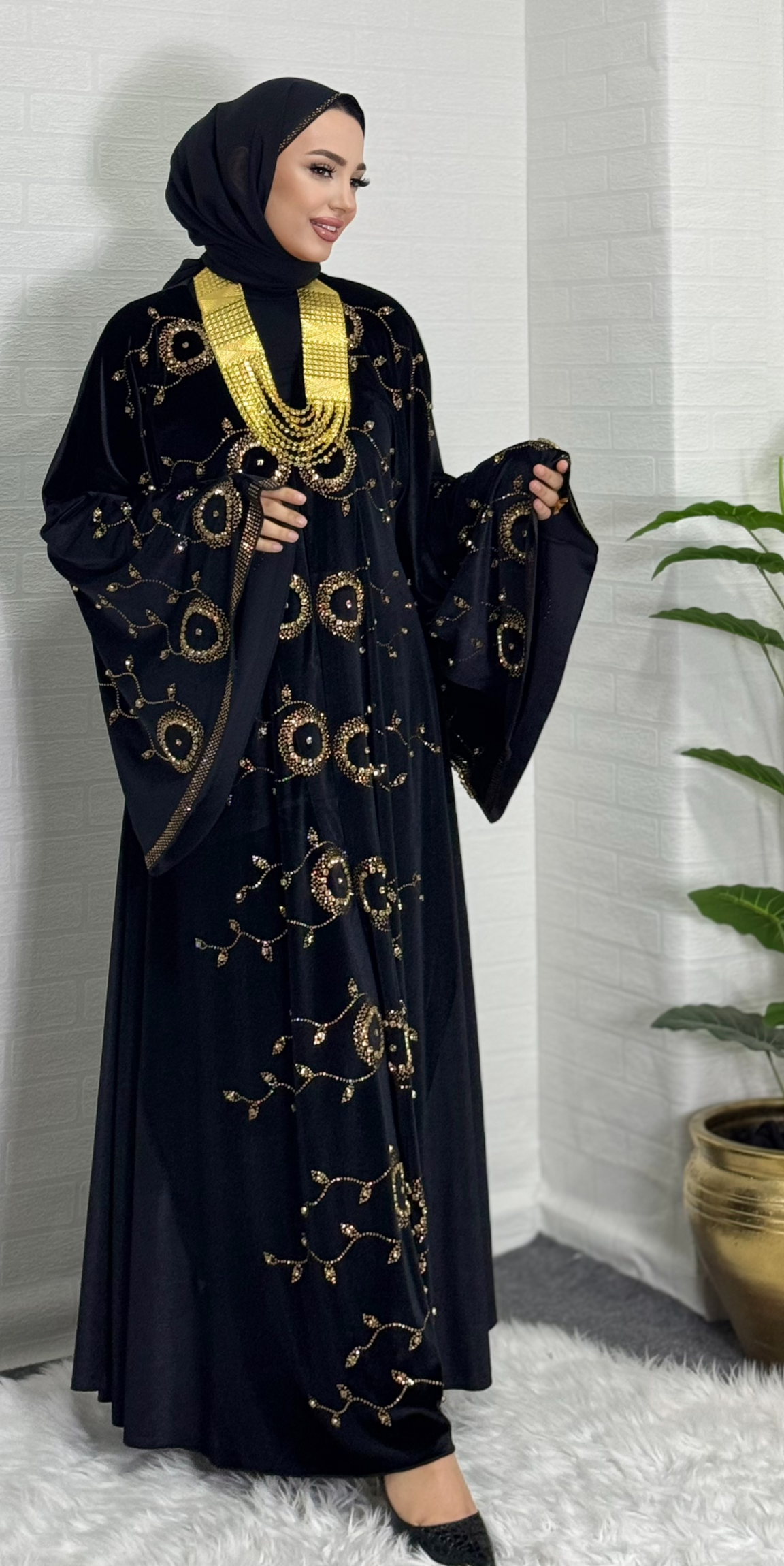 Velvet abaya decorated with gold stones on the front