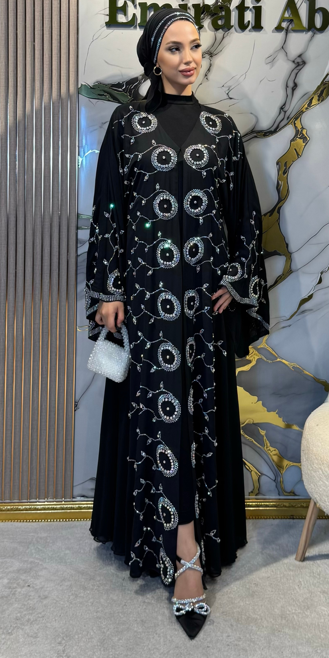 Black chiffon abaya embellished with JanJan stones on the front.