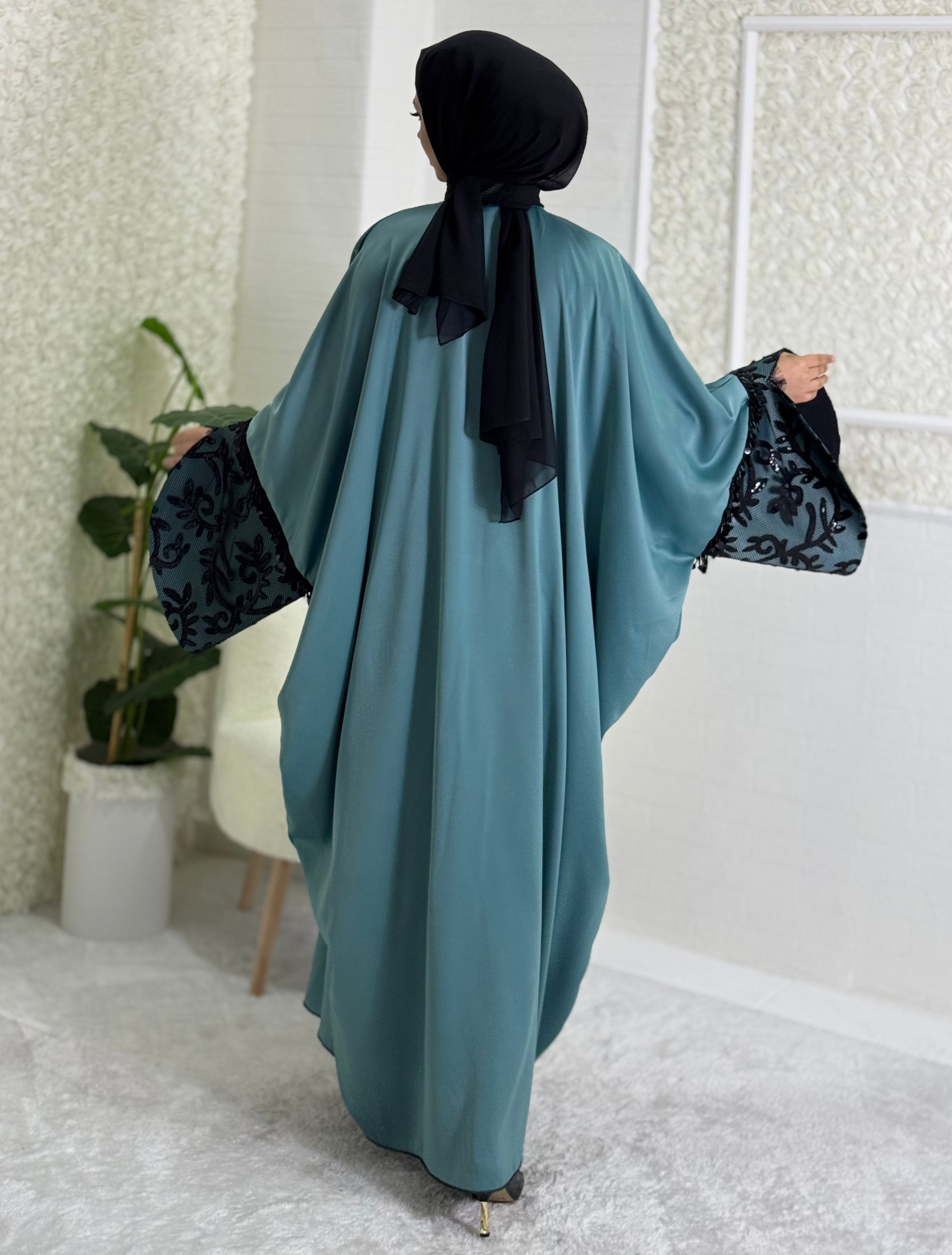 Turquoise satin abaya with black lace sleeves