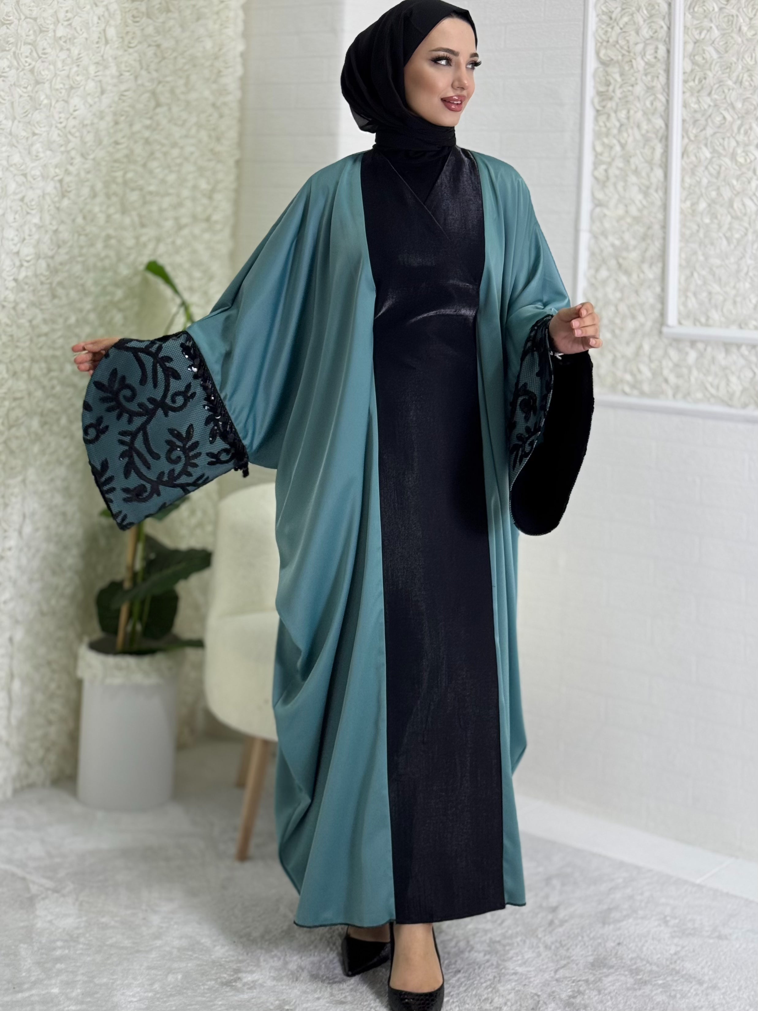 Turquoise satin abaya with black lace sleeves