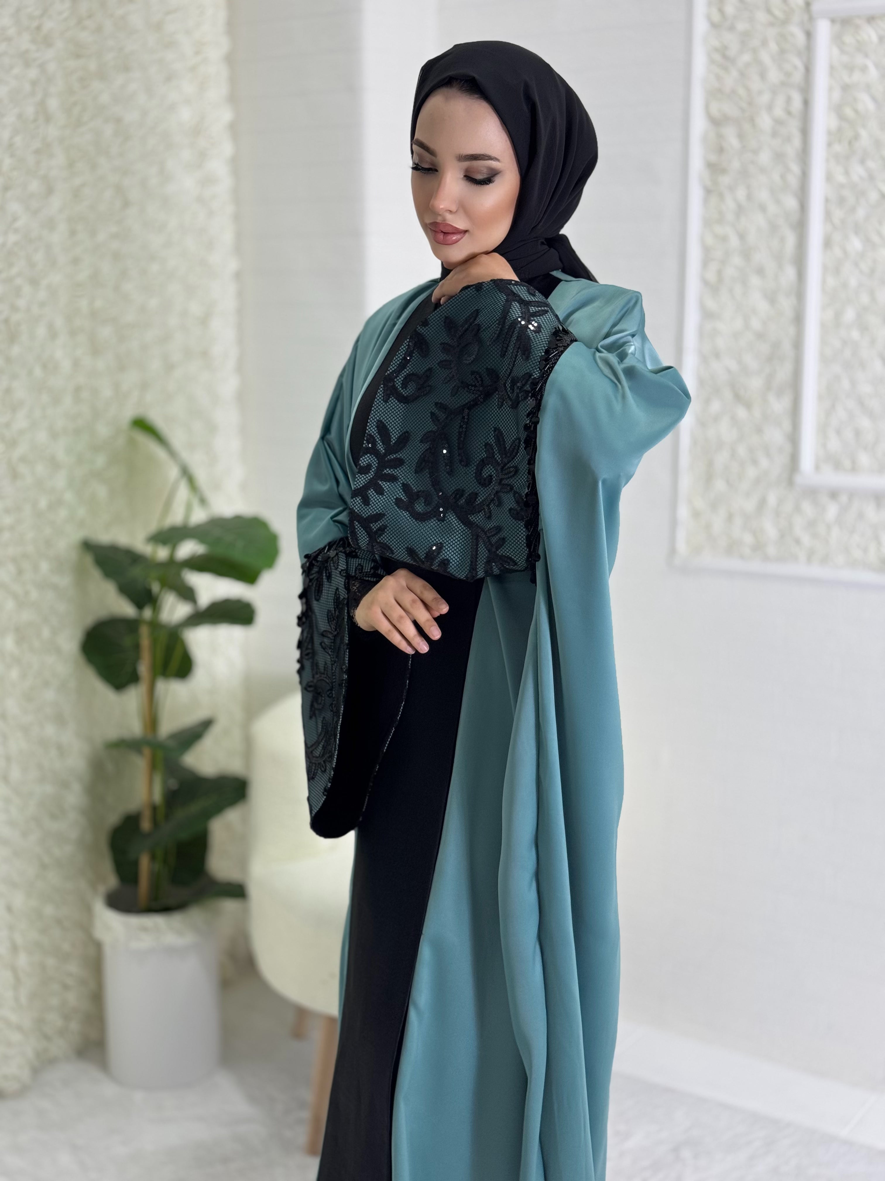 Turquoise satin abaya with black lace sleeves