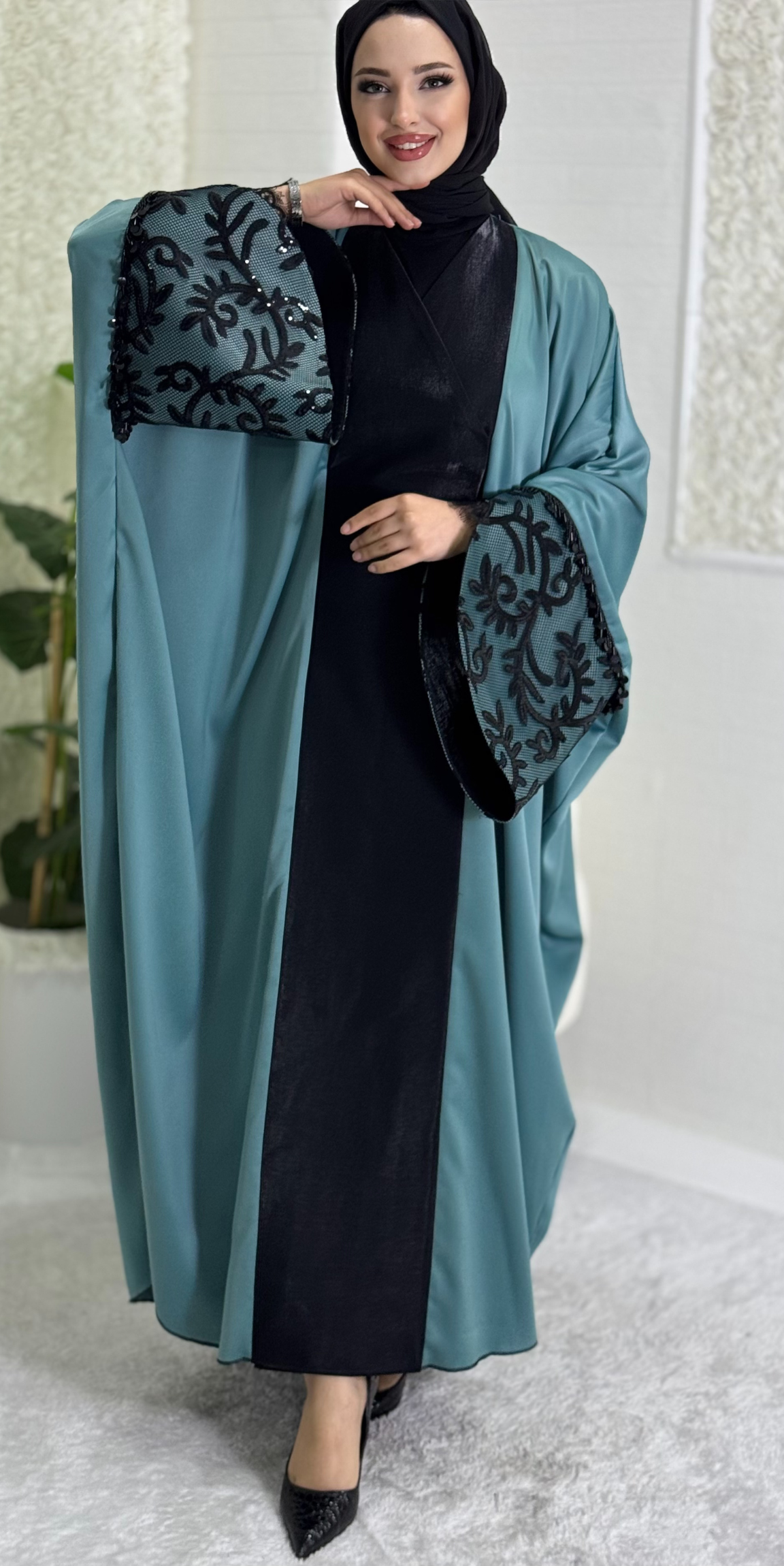 Turquoise satin abaya with black lace sleeves